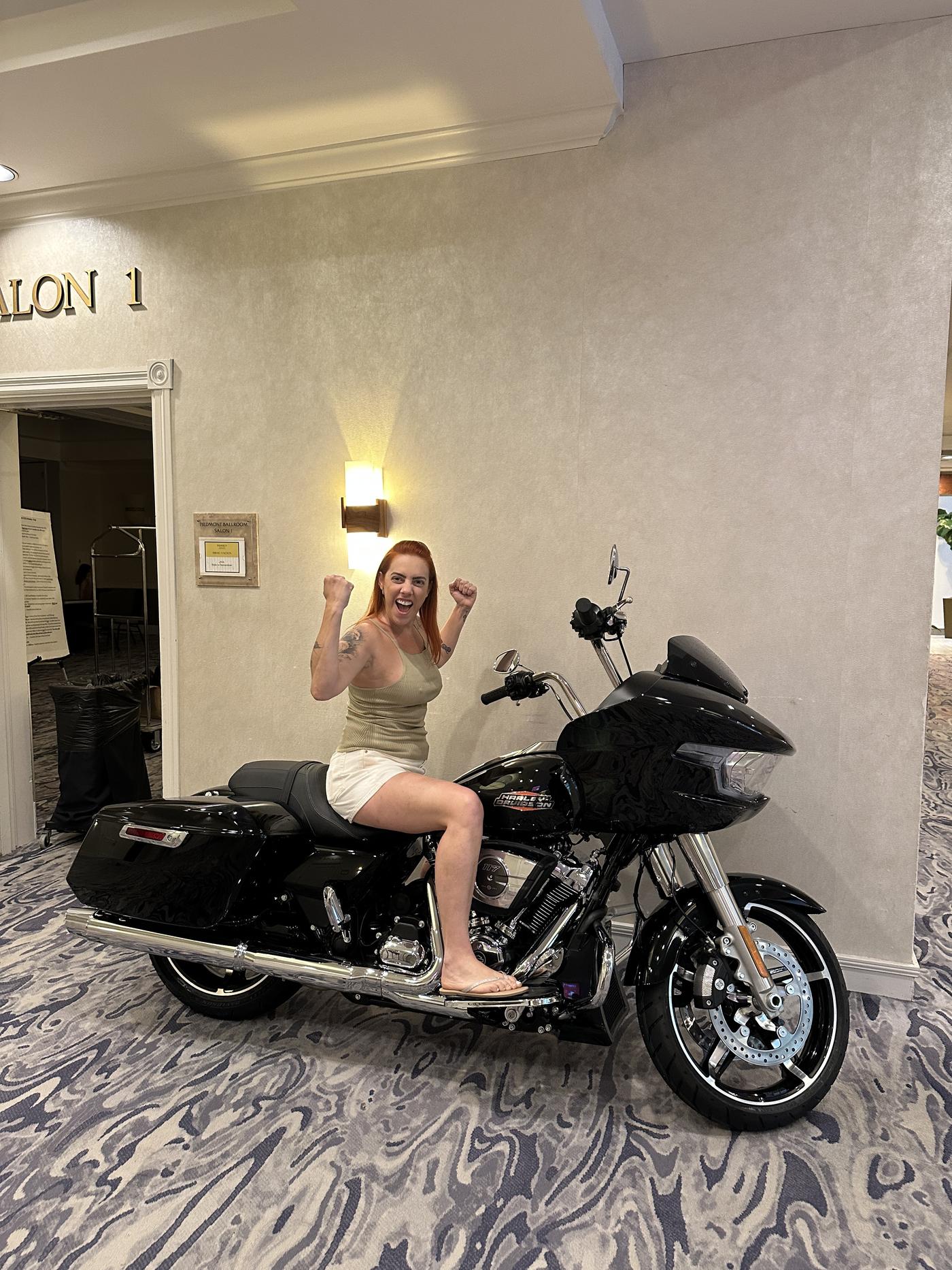 Fabi flexing on a Harley at the 2025 Ride 2 Remember in Charlotte, North Carolina